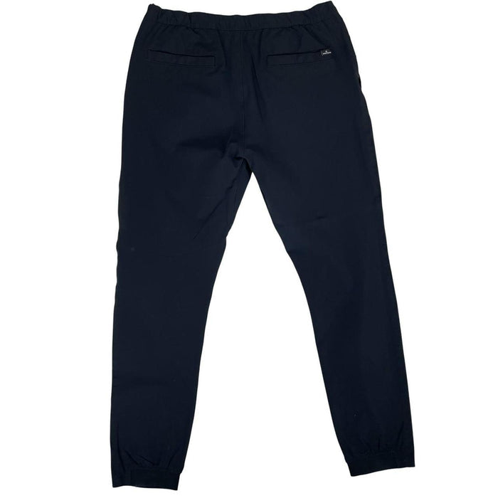 Stone Island navy blue joggers with logo patch and nylon material.