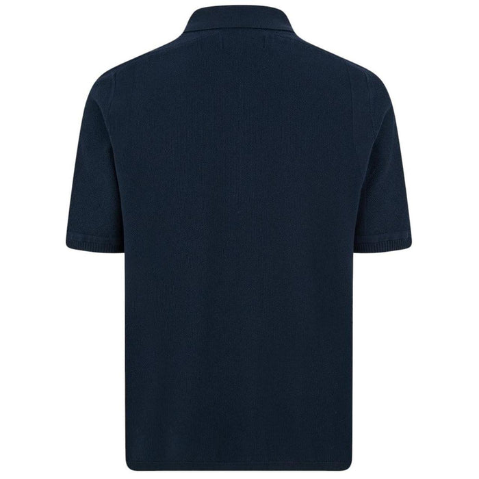 Stone Island navy blue polo shirt with Compass patch and three-button placket.