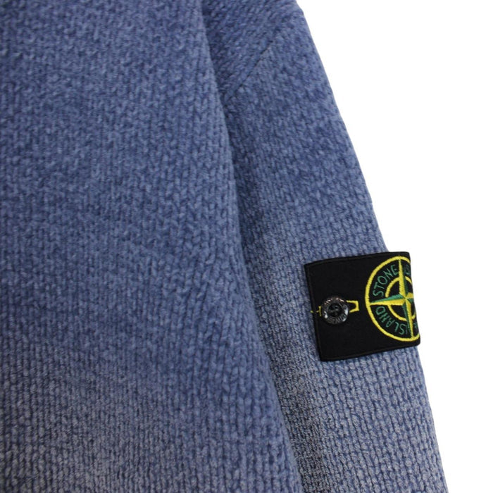 Stone Island blue jumper with degrade knit pattern and logo badge on sleeve.