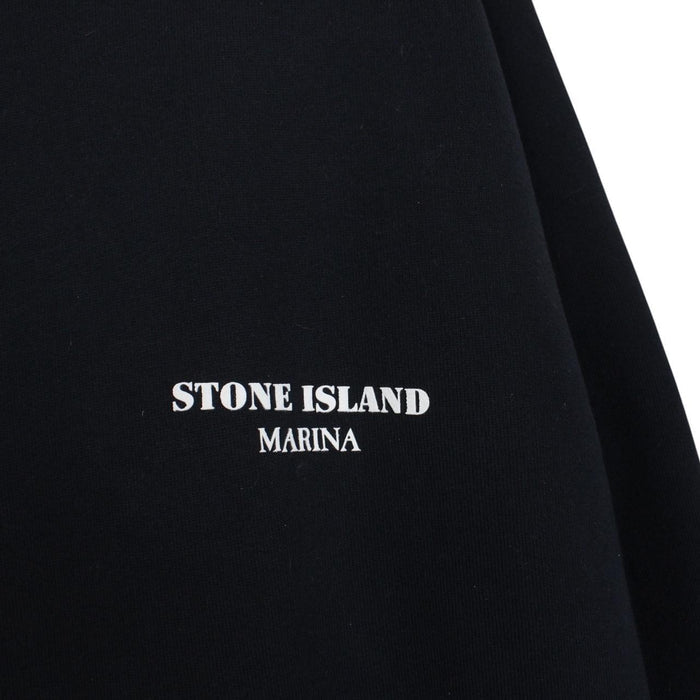 Stone Island beige and navy blue cotton hoodie with logo patch and drawstring hood.