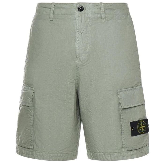 Stone Island green cargo shorts with multiple pockets and "OLD" effect garment-dye treatment.