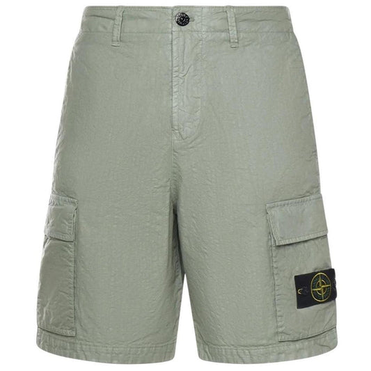 Stone Island green cargo shorts with multiple pockets and "OLD" effect garment-dye treatment.