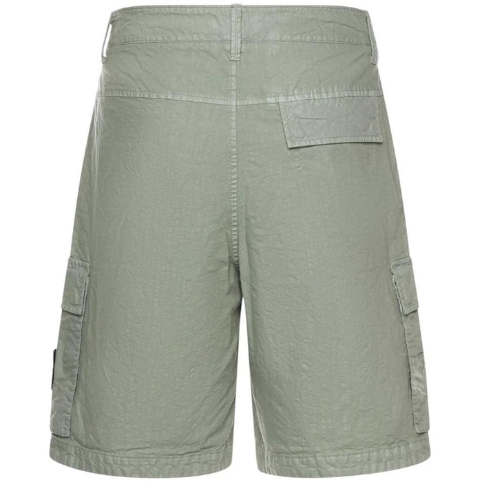 Stone Island green cargo shorts with multiple pockets and "OLD" effect garment-dye treatment.