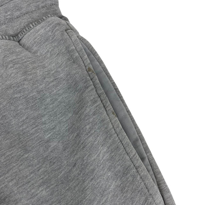 Stone Island grey joggers with logo patch and cotton material, size small.