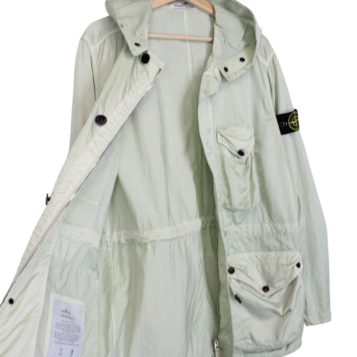 Stone Island mint green multi pocket jacket with logo patch and nylon material.