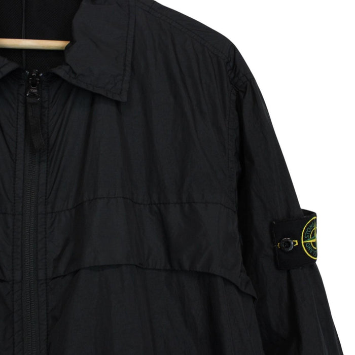 Stone Island black overshirt jacket with full zip, two zipped pockets, and snap button cuffs.