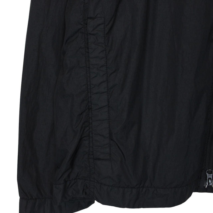 Stone Island black overshirt jacket with full zip, two zipped pockets, and snap button cuffs.