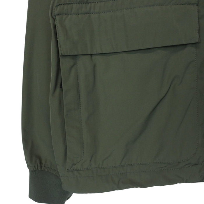 Stone Island green full zip jacket with packable hood and removable brand patch.