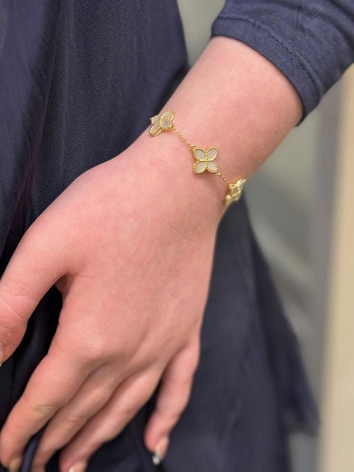 Gold bracelet on a wrist