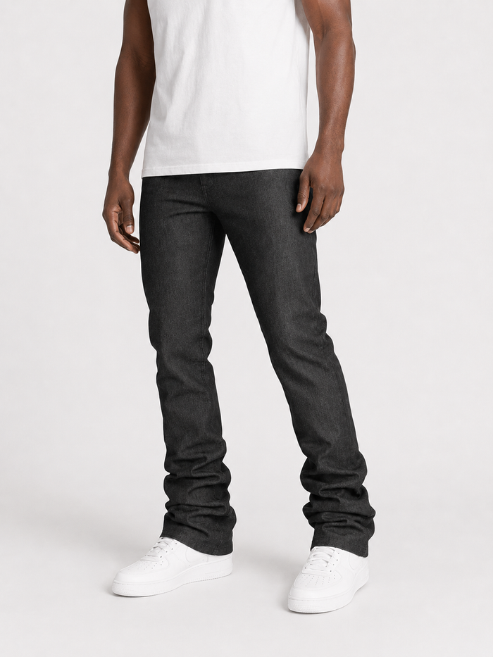 Taker Raw Fabric Stack Denim in raw black showing the dark, textured raw denim fabric with stacked design details.