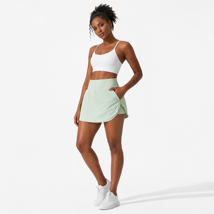 Women's sports skort front angle showing the cool-sense concept, fitted waist and layered culotte look for warm-weather wear.