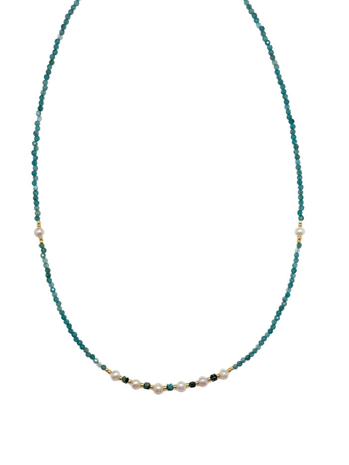 Tessa Apatite and Miyuki Bead Necklace with blue-green apatite beads, pearl center section, and stainless steel details on white background.