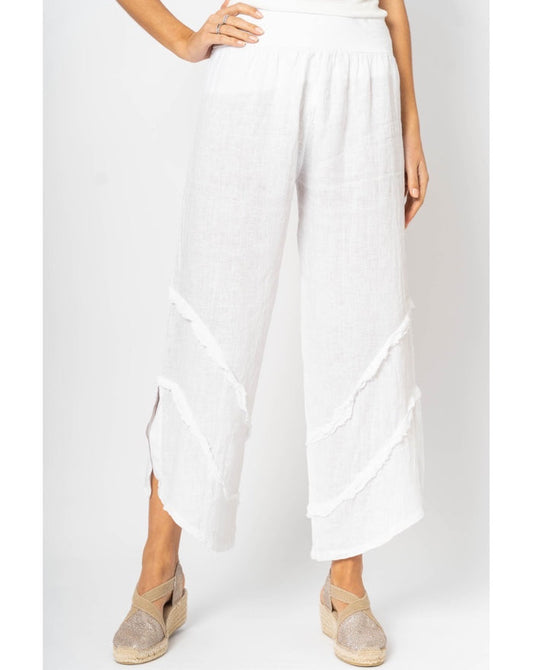 Tia Italian Linen Pants in White with fray ruffle detail and side slit at Ardor Boutique. front view