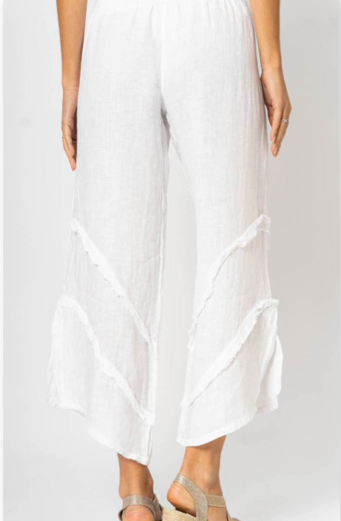 Tia Italian Linen Pants in White with fray ruffle detail and side slit at Ardor Boutique. back view