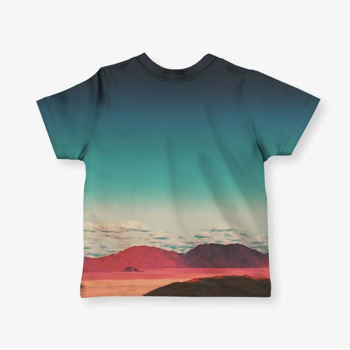 Vaporwave Goddess Kid's Tee - The floating, sepia-toned Greco-Roman statue head against the "cosmic slate navy (#212F3C)" and "vintage teal sky (#5F9EA0)" gradient, a direct reference to the visual language of foundational vaporwave music releases like Macintosh Plus's Floral Shoppe album art