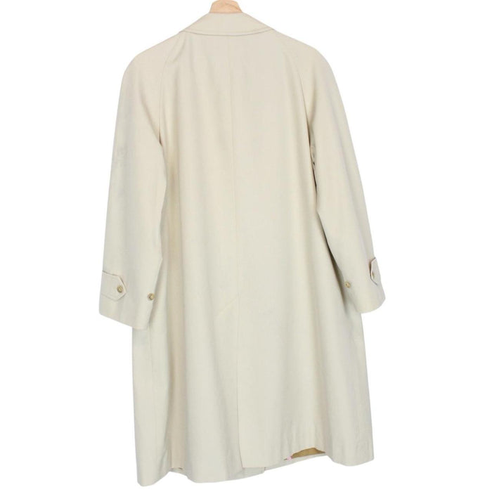 Burberry cream trench coat, single breasted, vintage 80s style, visible mark on sleeve.