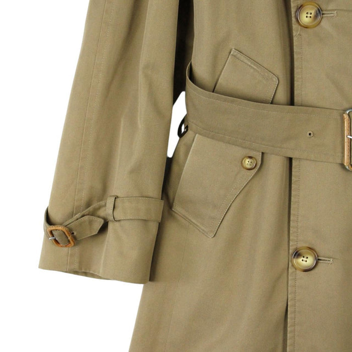 Burberry brown double breasted belted trench coat with classic check lining and logo details.
