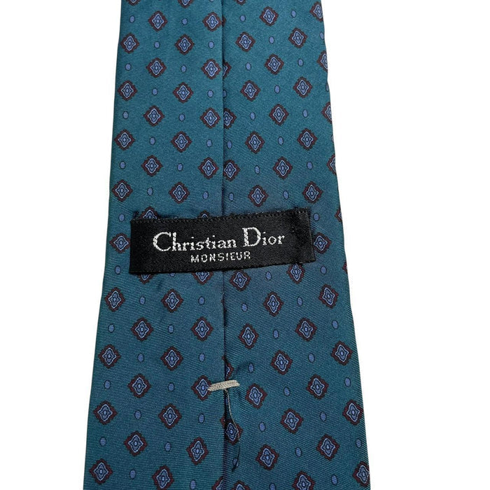 Christian Dior blue silk tie with subtle sheen and classic design.