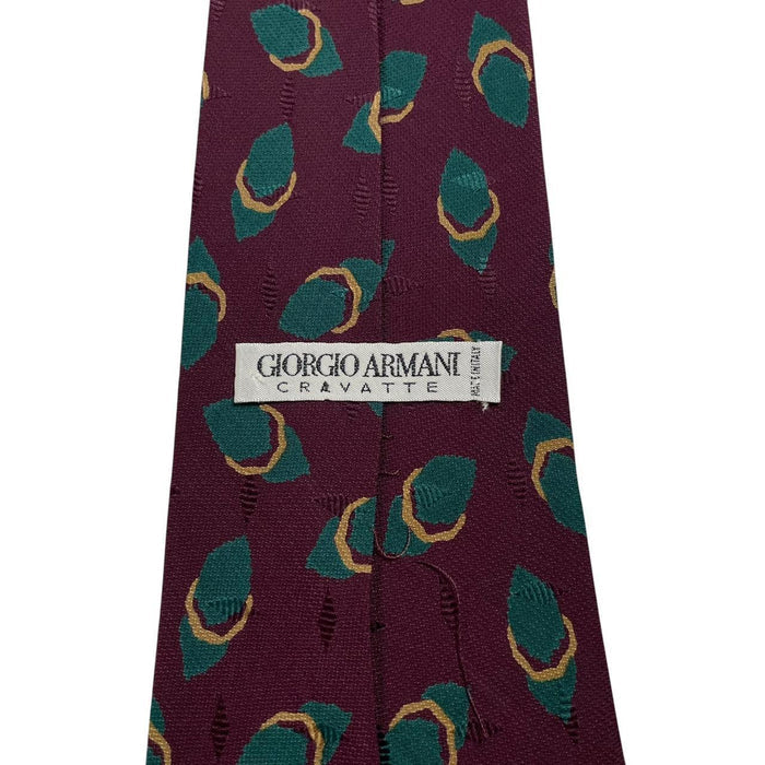 Giorgio Armani burgundy silk tie with geometric print and logo detail.
