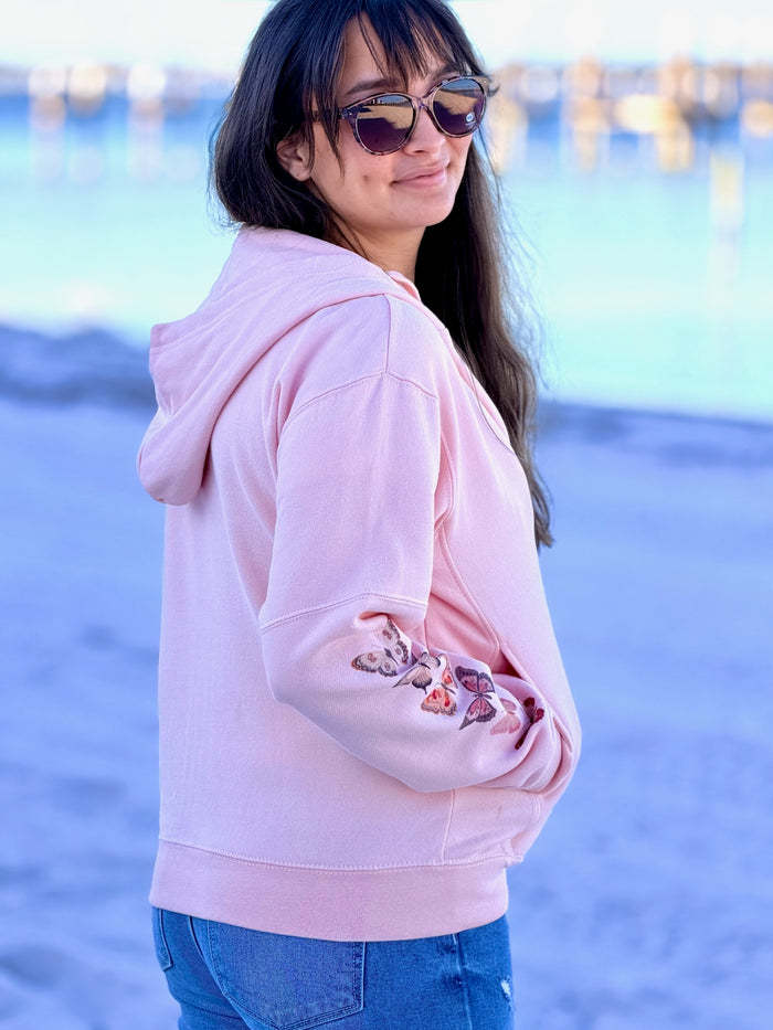 pink watercolor butterfly sleeve hoodie on a women