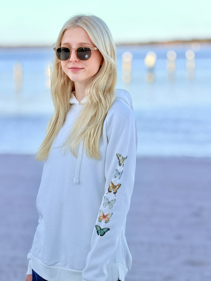 Woman wearing an ardor watercolor butterfly hoodie