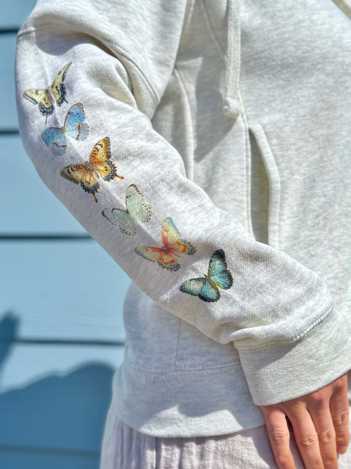 close up of neutral butterfly watercolor sleeve