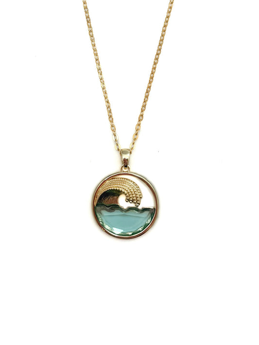 Gold necklace with a blue pendant on a white background