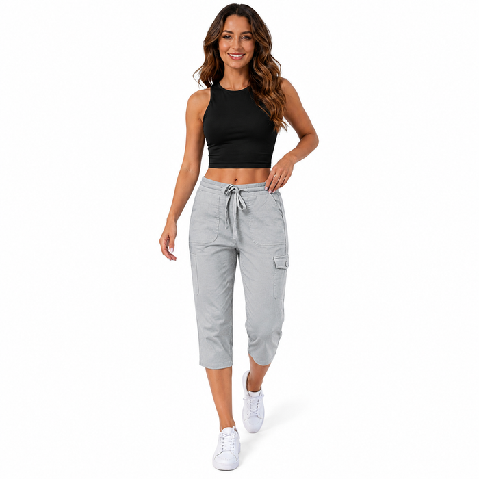 Flat lay of solid color capri trousers with casual styling accessories