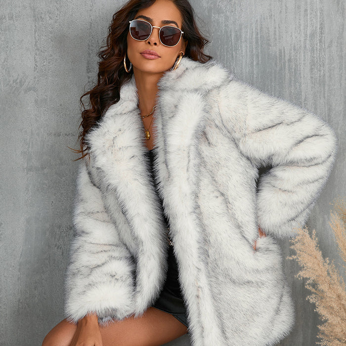 leopard print faux fur coat with lapel front and long sleeves paired with black basics for statement outerwear