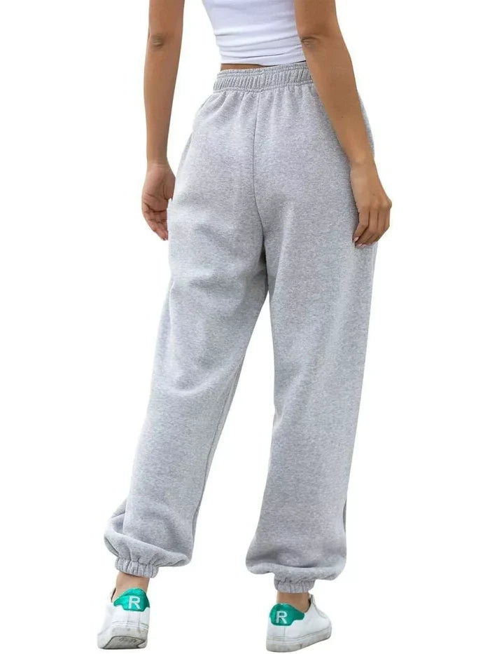 Casual women's joggers offering an easy loose fit, drawstring and pockets with a rayon polyester spandex material composition