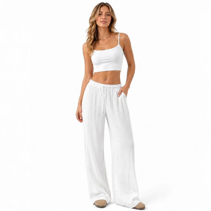 Women's white wide leg cotton pants with a high waist and wrinkled finish for casual commuter outfits and simple top pairing.