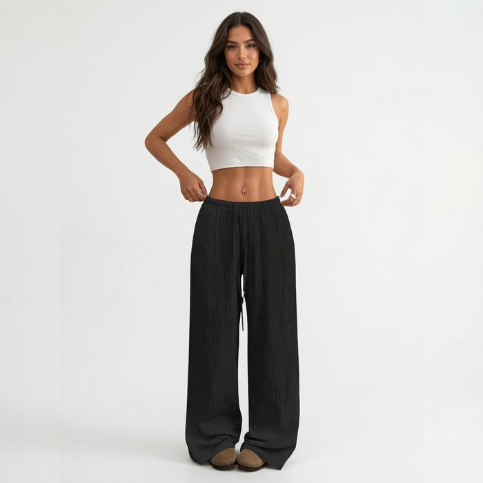 Women's black wide leg cotton pants with a high waist and wrinkled finish for casual commuter outfits and simple top pairing.