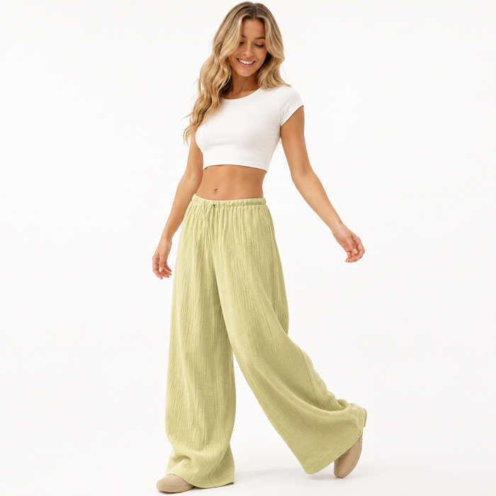 Women's apricot wide leg cotton pants with a high waist and wrinkled finish for casual commuter outfits for modern wardrobes.