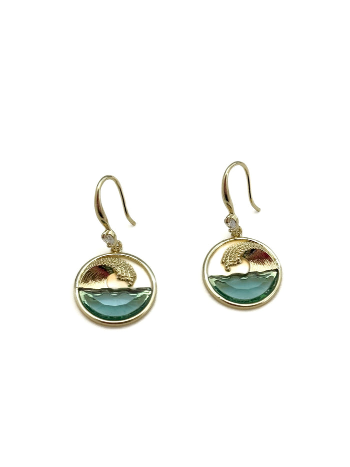Gold earrings with green wave design on a white background